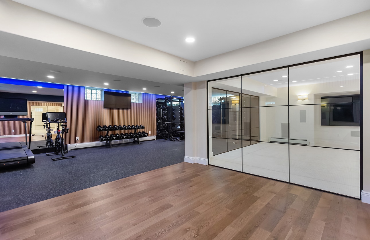 basement with workout space and glass walls